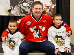 Colby Armstrong poses with fans before a Johnstown Tomahawks game