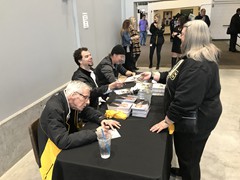Hockey Hall of Famer, Mike Lange and former Pens player, Tyler Kennedy signing autographs during a Wheeling Nailers game
